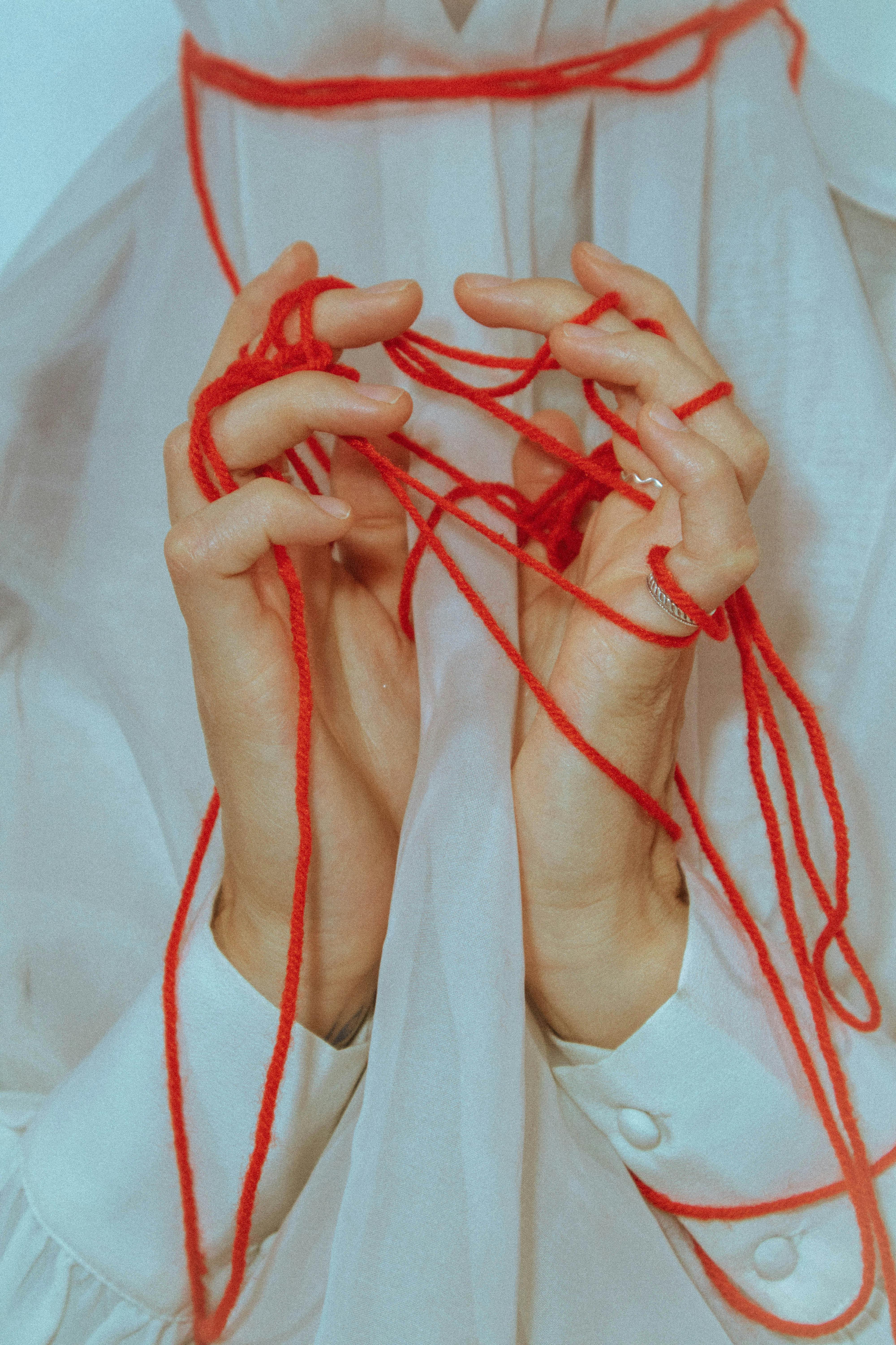 Red textile hands